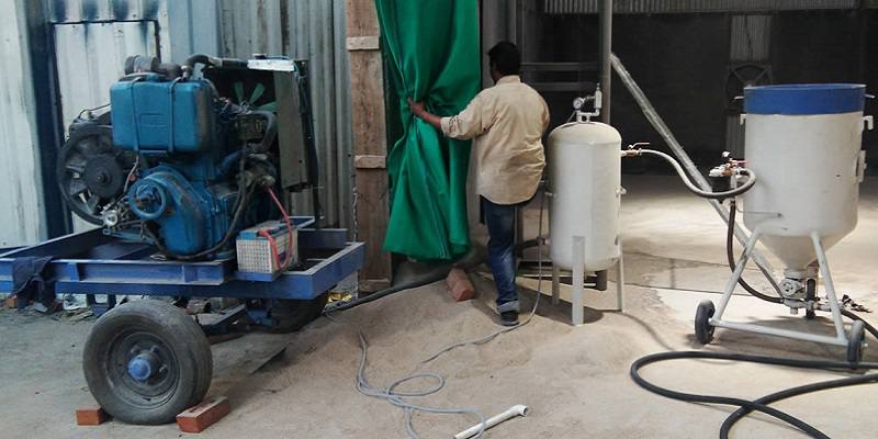 What is sand blasting machine and Work handling system of Sandblasting machine?
